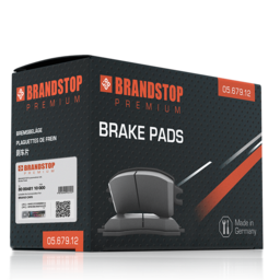 一盒优质“Brandstop”刹车片，采用黑色和橙色包装。包装盒内含一个VeoMark®激光光刻标签，用于高级防伪，结合可见和隐藏的安全元素，方便产品验证。该标签为消费者和经销商提供了高度的安全性。